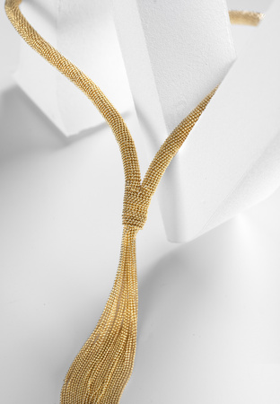 Gruby naszyjnik z chwostem z łańcuszków w złotym kolorze