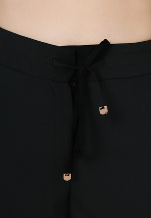 Szerokie spodnie z troczkami