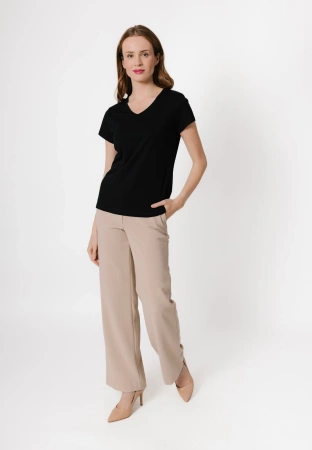 Beżowe spodnie z szeroką nogawką