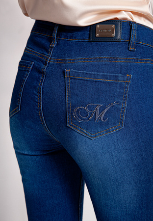 Granatowe jeansy slim z przetarciami