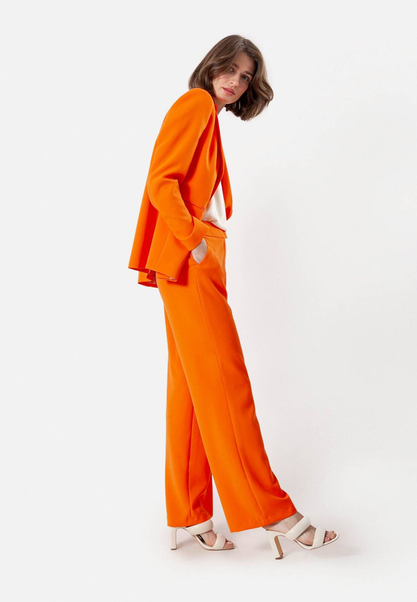 Pomarańczowe spodnie z szeroką nogawką