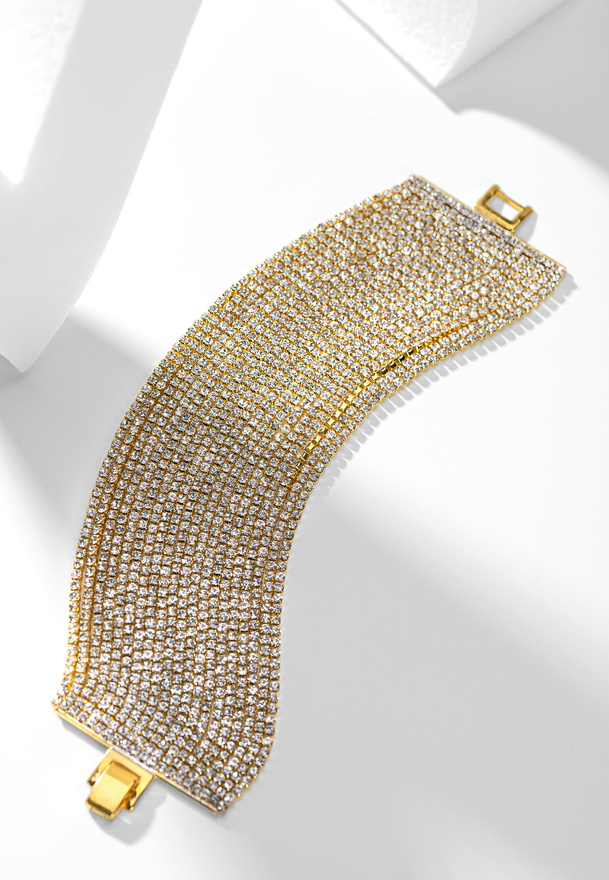 Elegancka bransoletka zdobiona kamieniami w złotym kolorze